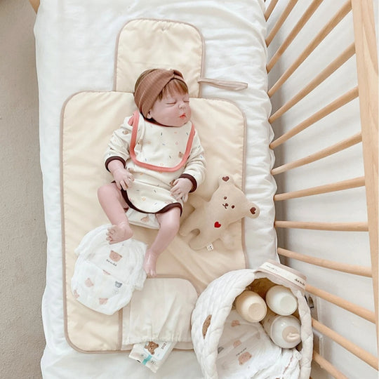 Changeur de couches pliable pour bébé